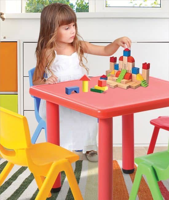 Child building blocks at a kids table